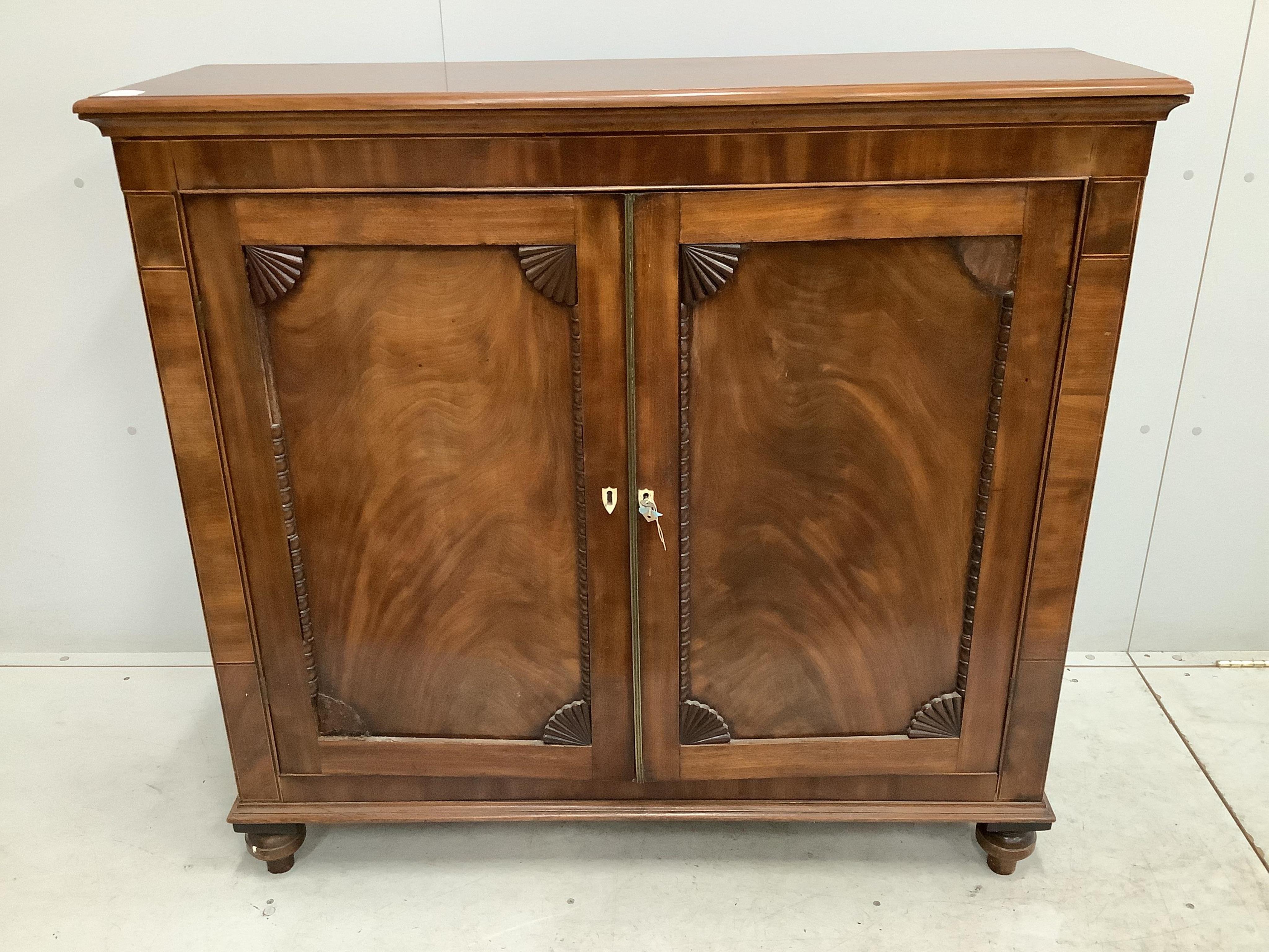 An early Victorian mahogany side cabinet, with bone escutcheons, width 118cm, depth 36cm, height 111cm. Condition - poor to fair